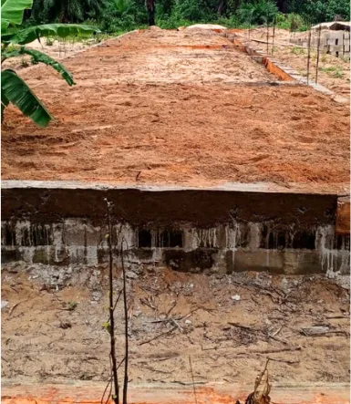 Poured concrete foundation slab of the New Cess school with reinforcement bars in place