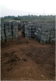 Concrete blocks stacked and curing at the New Cess school site