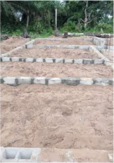 Block foundation walls laid out across the New Cess school footprint